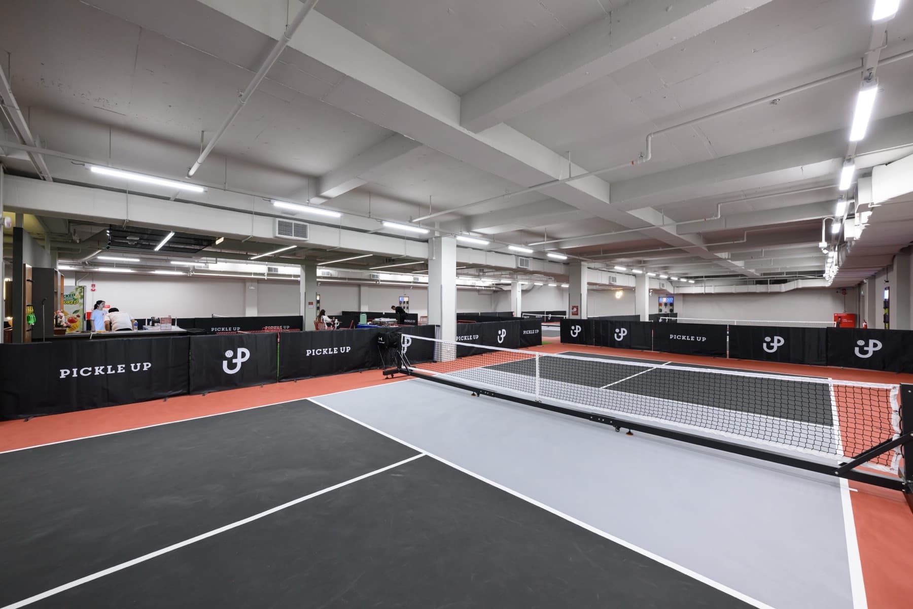 Court 1, an Executive court, empty, with the Pickle Up hall beyond.